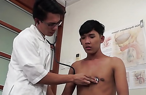 Asian doctor inspecting twinks butt