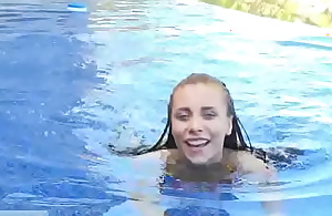 Sexy teen mediocre girl Anyah fucking her tight breech with glass sex dildo in the open-air pool